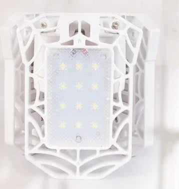 White tech accessory with geometric cage design and LED lights, futuristic style.