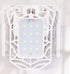 White tech accessory with geometric cage design and LED lights, futuristic style.