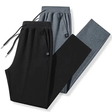 Black and gray slim fit jogger pants with drawstring waist, soft material, modern streetwear style