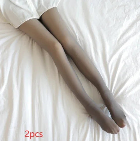 Sheer nude tights with a smooth finish and slim fit, worn with white shorts on a bed