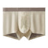 Beige seamless boxer briefs with breathable mesh pouch and stretch waistband, slim fit.
