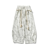 Wide-leg tie-dye pants in light gray with drawstring waist and relaxed fit streetwear style