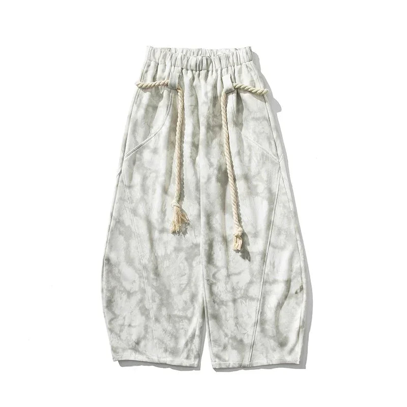 Wide-leg tie-dye pants in light gray with drawstring waist and relaxed fit streetwear style