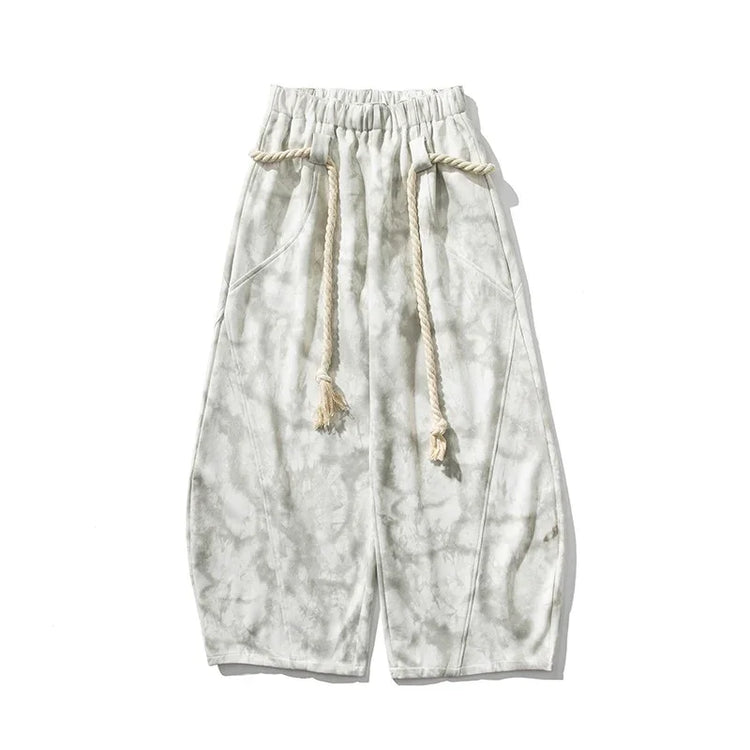 Wide-leg tie-dye pants in light gray with drawstring waist and relaxed fit streetwear style