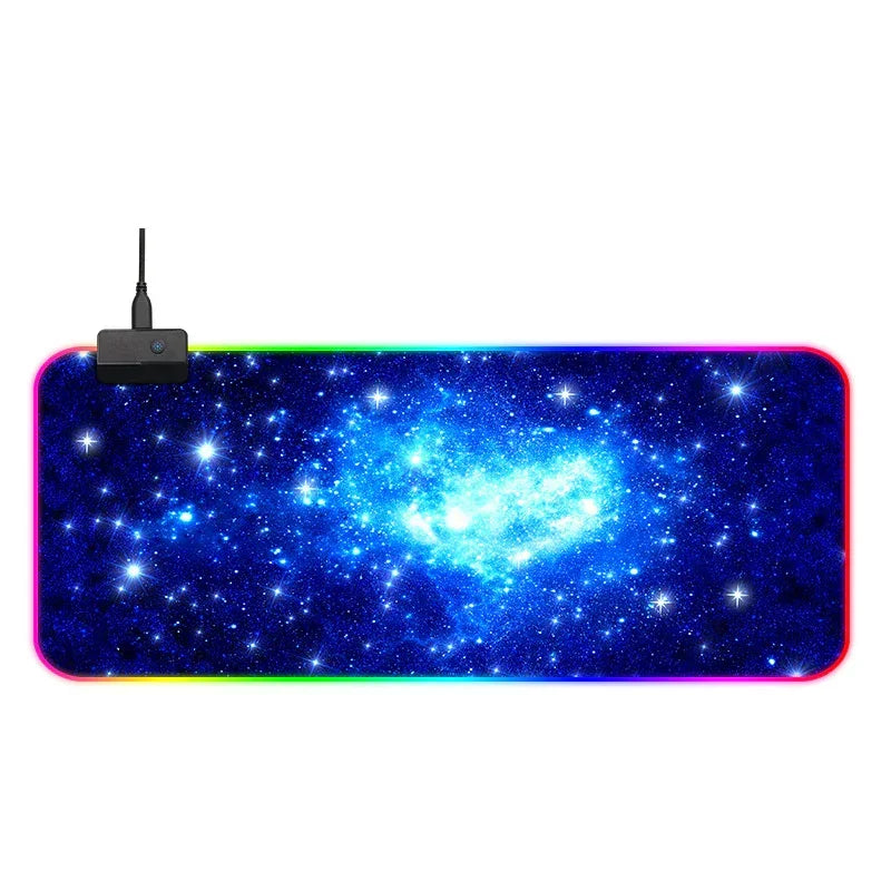 Large RGB gaming mouse pad with blue galaxy print, soft fabric surface, non-slip base