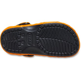 Bottom view of Crocs Unisex-Adult Classic Pokemon Clog in Charizard color with black sole and tread pattern