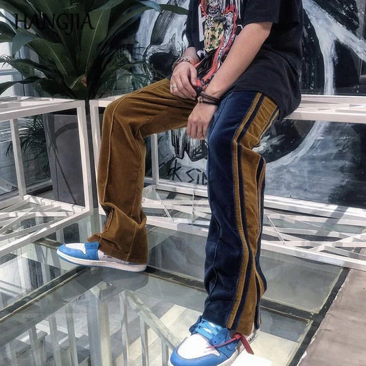 Colorblock velvet pants with flared legs, brown and navy panels, relaxed streetwear fit