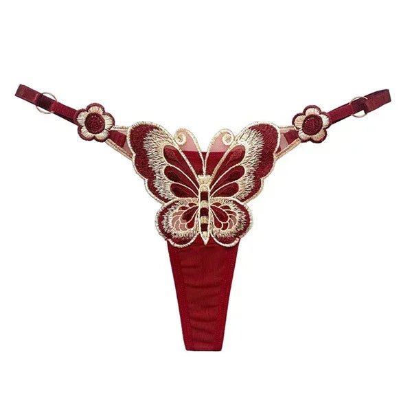 Red lace thong with butterfly embroidery, floral side accents, and adjustable straps