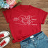 Red cotton graphic t-shirt with white line art, relaxed fit, paired with denim shorts