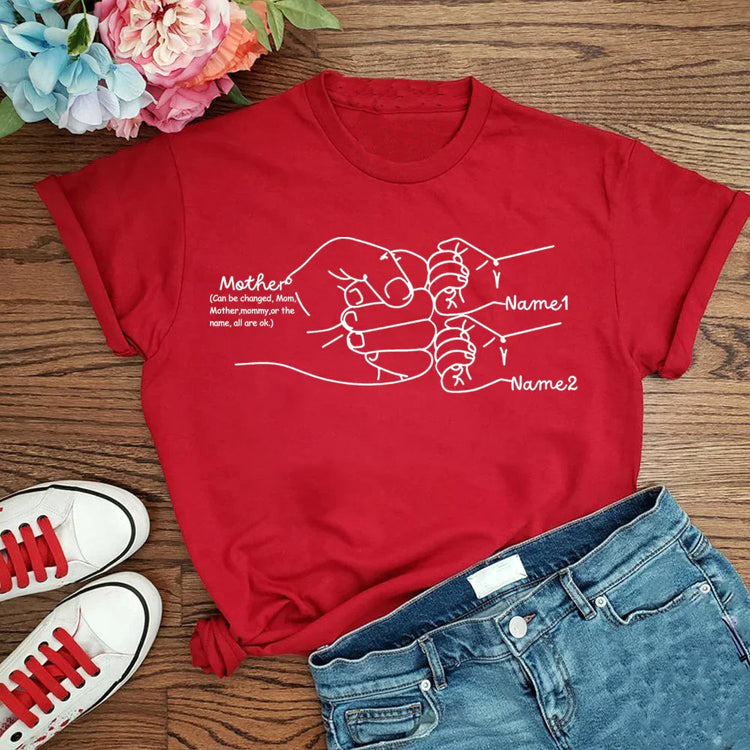Red cotton graphic t-shirt with white line art, relaxed fit, paired with denim shorts