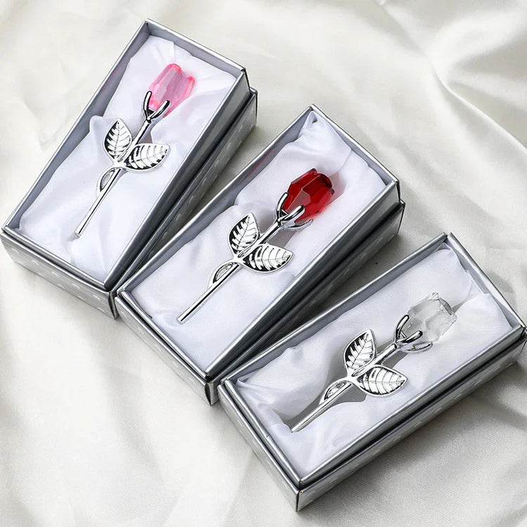 Crystal rose brooches with silver stems in gift boxes, featuring red, pink, and clear colors.