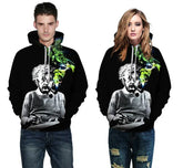 Black graphic hoodie with colorful smoke print and relaxed fit, styled with ripped jeans