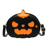 Black and orange pumpkin-shaped faux leather crossbody bag with Halloween face design