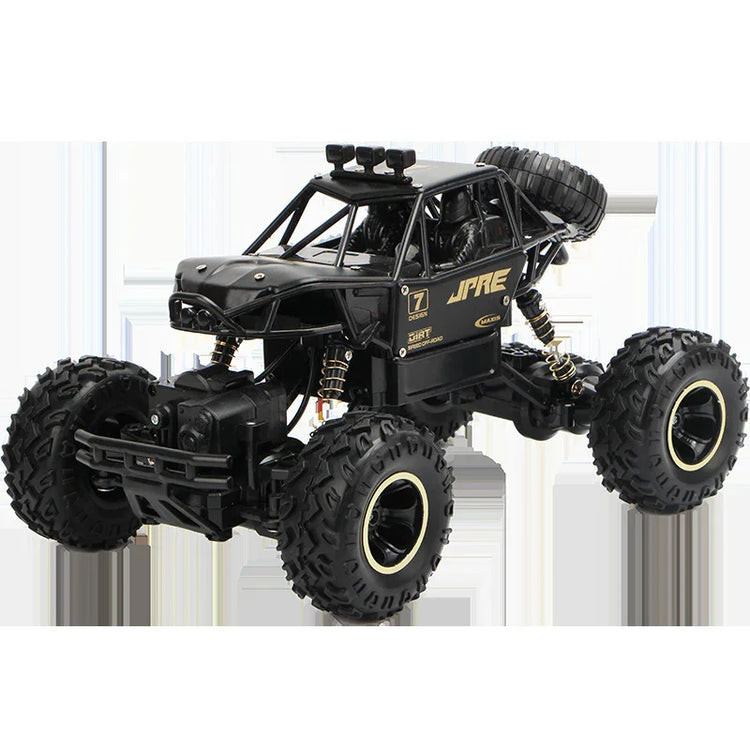 Black off-road RC truck with rugged tires, gold accents, and exposed suspension details