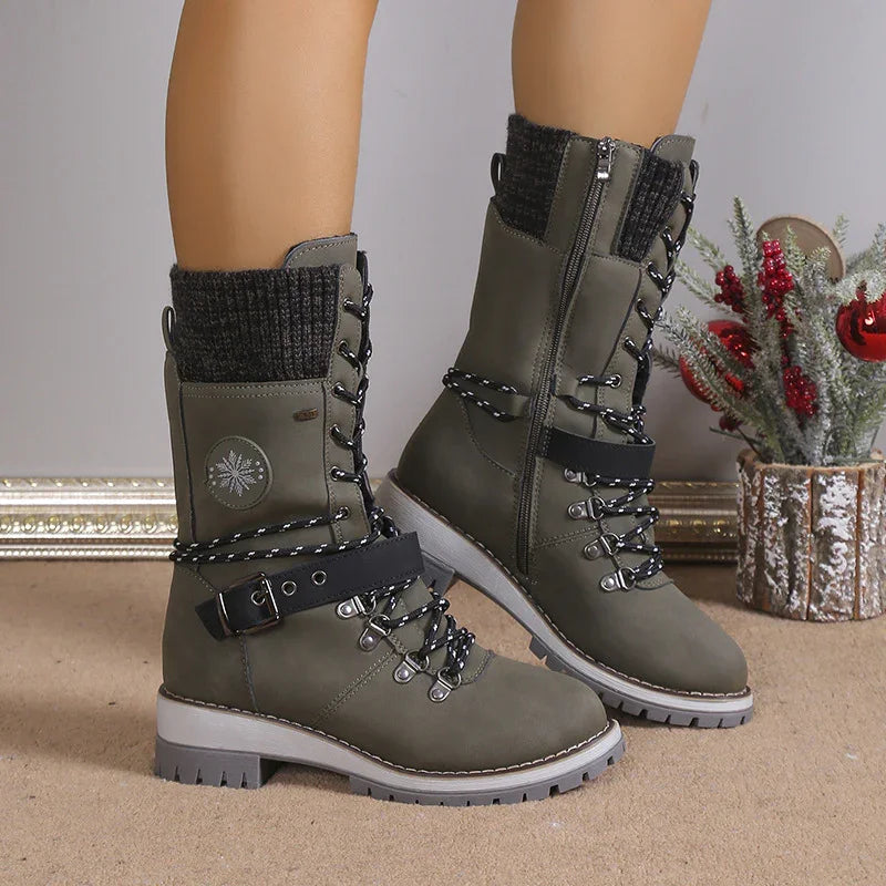 Olive green lace-up winter boots with black knit cuffs, thick soles, and adjustable straps.