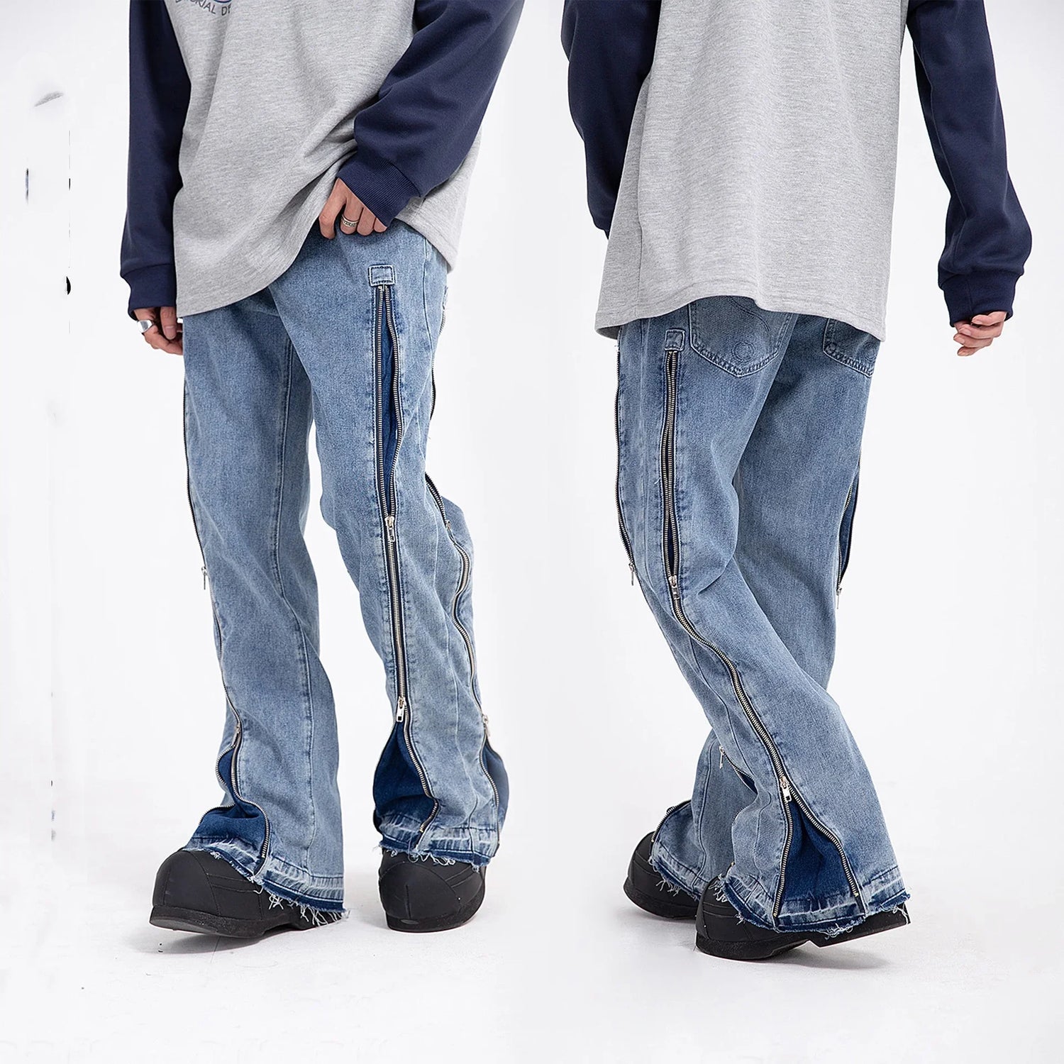 Baggy light blue denim jeans with side zippers and raw hem, streetwear style