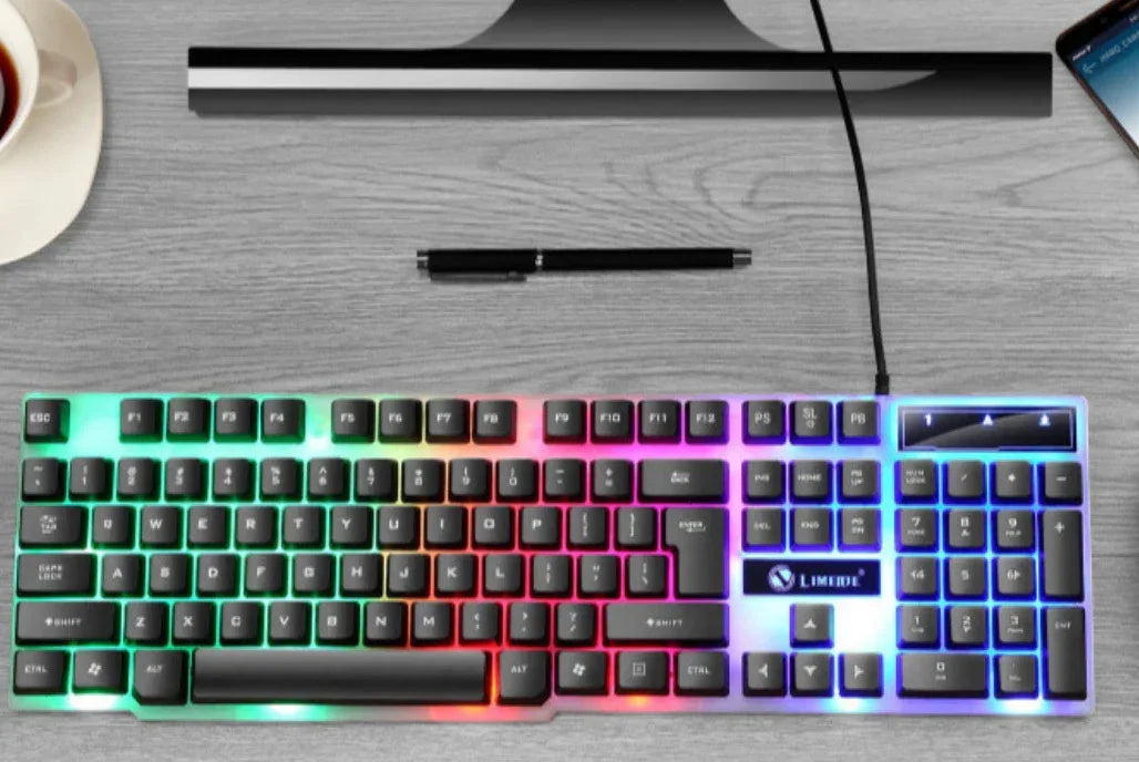 RGB backlit wired keyboard with black keys on a modern desk setup
