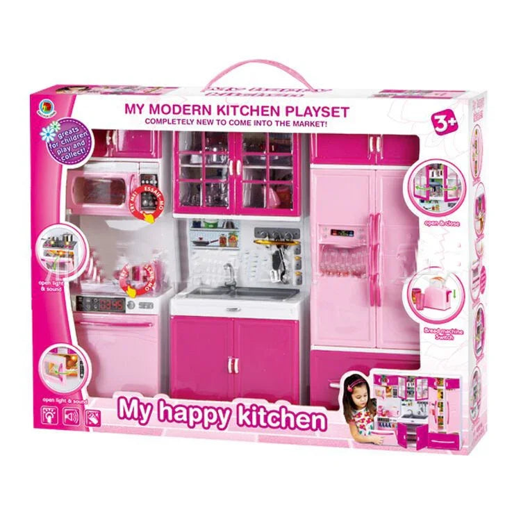 Pink and white modern kitchen playset with cabinets, fridge, and sink for kids.