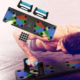 Man using a multi-color push up board system for bodyweight exercise on gym floor