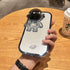 Glossy silver phone case with 3D astronaut design, held in hand on wooden table