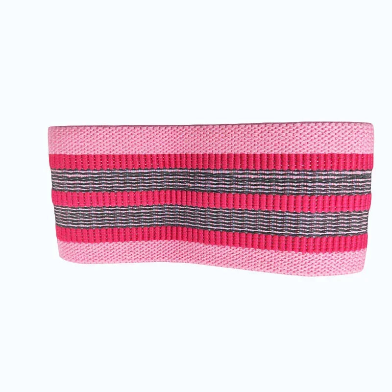 Wide pink and black striped knit headband with ribbed texture and stretchy fabric.