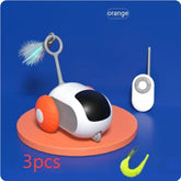 Futuristic toy robot car with orange wheels and feather, remote control, and cleaning brush on a round orange platform.