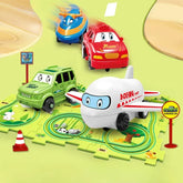 Colorful toy airplane, train, cars with cartoon faces on a playmat road track set