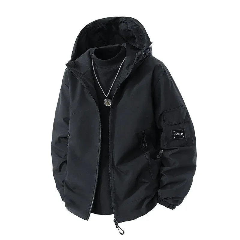 Black hooded streetwear jacket with zipper, utility pocket, relaxed fit, and layered necklace