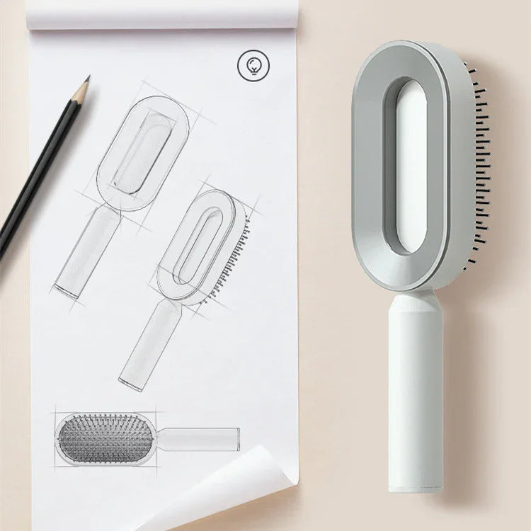Modern oval gray plastic hairbrush with ergonomic handle, next to design sketches