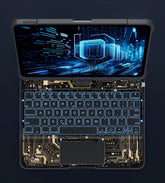 Futuristic transparent keyboard with circuit design and glowing blue backlight, laptop setup