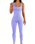 Woman wearing a fitted pastel purple ribbed jumpsuit with tank straps and seamless design