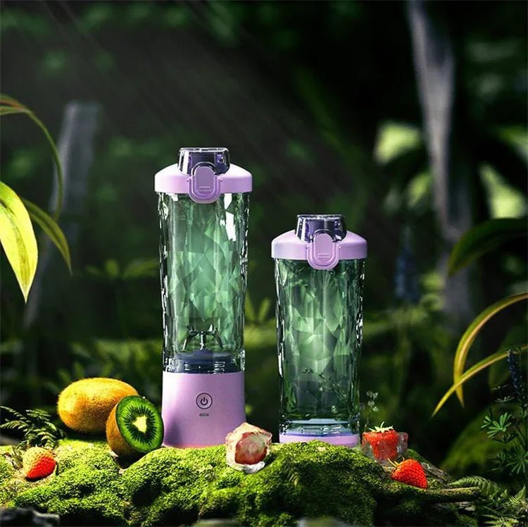 Crystal-textured green portable blender and bottle set with purple lids, shown in a forest with fruit.