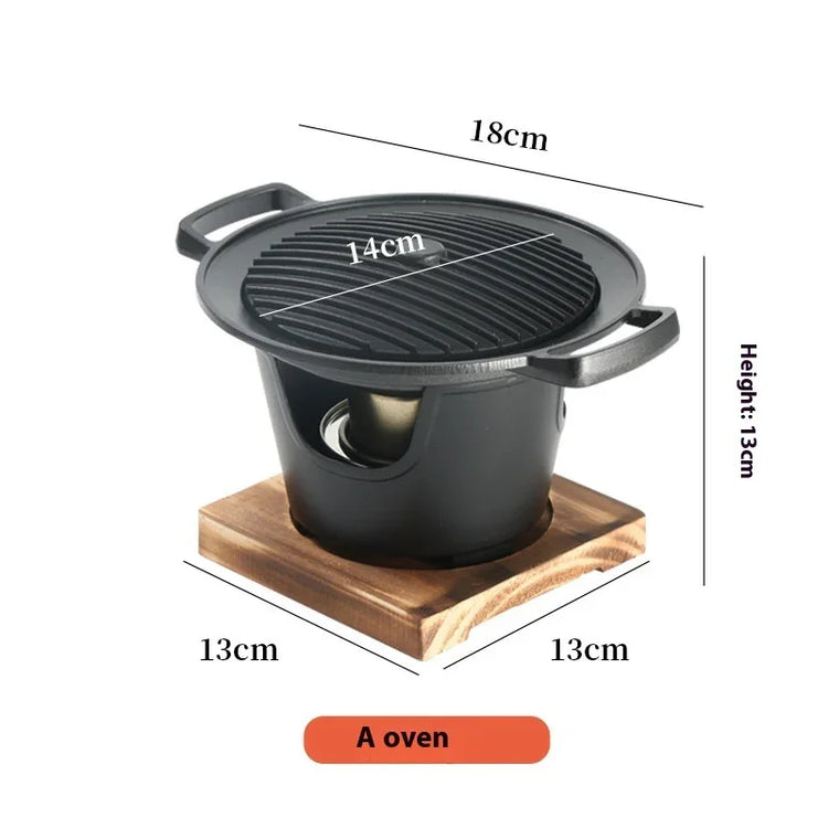 Compact black cast iron tabletop grill with wooden base, round ridged top, dimensions labeled.