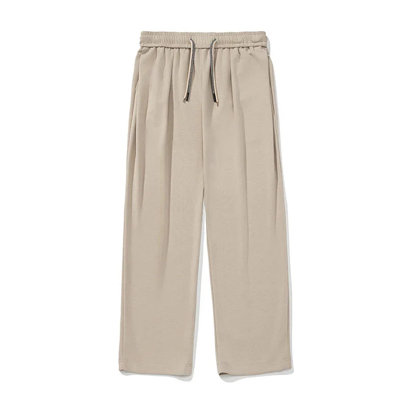 Beige wide-leg pants with drawstring waist, relaxed fit, soft fabric, minimalistic style