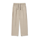 Beige wide-leg pants with drawstring waist, relaxed fit, soft fabric, minimalistic style