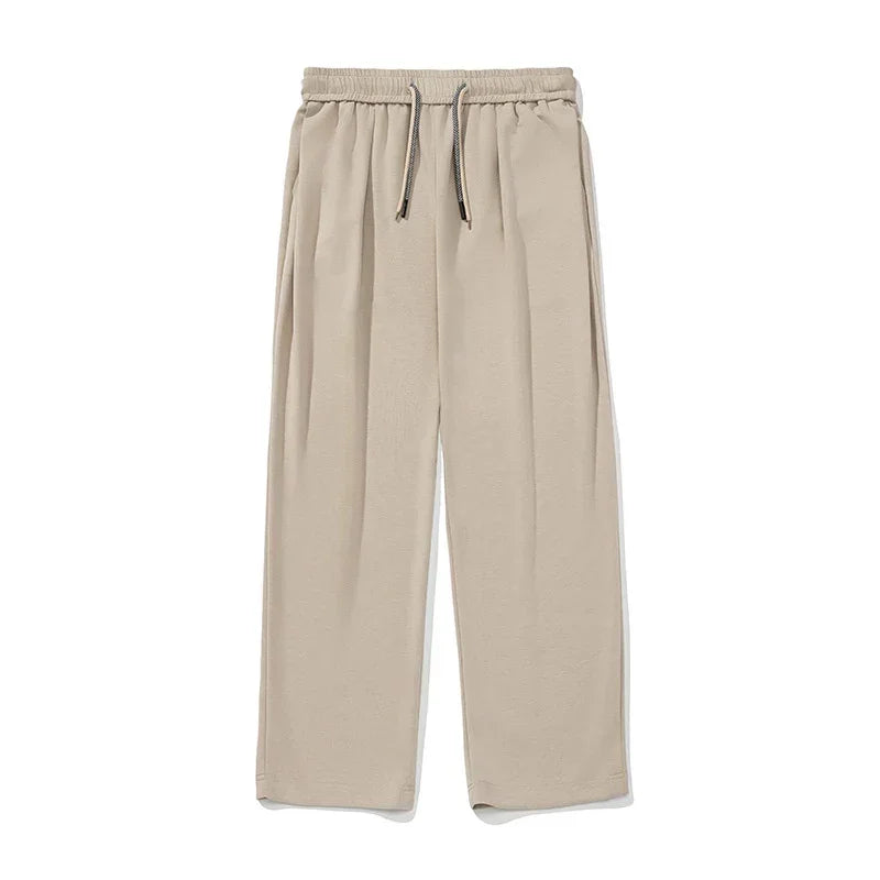 Beige wide-leg pants with drawstring waist, relaxed fit, soft fabric, minimalistic style