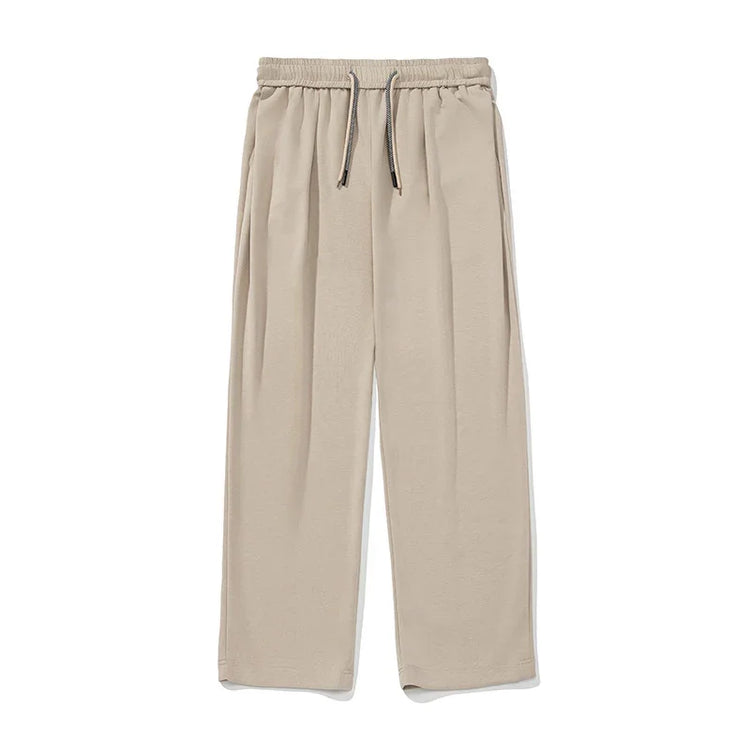 Beige wide-leg pants with drawstring waist, relaxed fit, soft fabric, minimalistic style