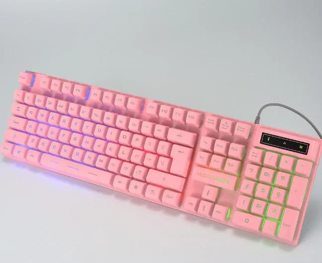 Pink mechanical keyboard with RGB backlighting and full number pad on white background