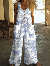 Woman wearing loose-fit white jumpsuit with blue animal print, button front, sleeveless design