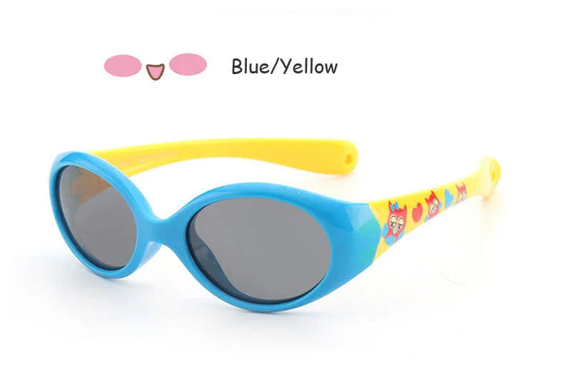 Blue and yellow oval sunglasses with cartoon print arms and dark lenses, plastic frame