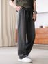 Loose fit gray wide leg pants with drawstring waist, soft fabric, paired with white sneakers
