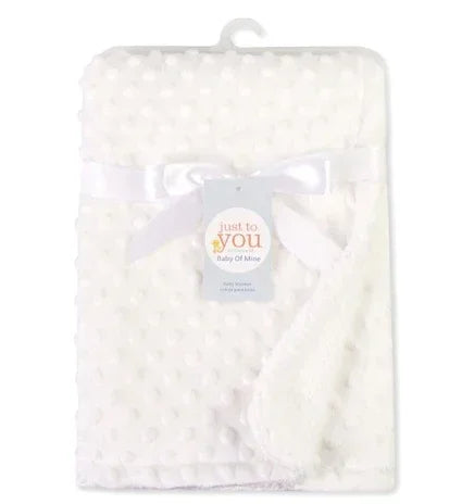 Soft white minky dot textured blanket with satin trim, plush and cozy material, folded display