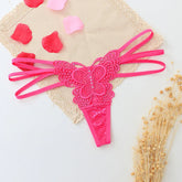 Hot pink lace butterfly thong with strappy sides and floral lace accents, feminine lingerie.
