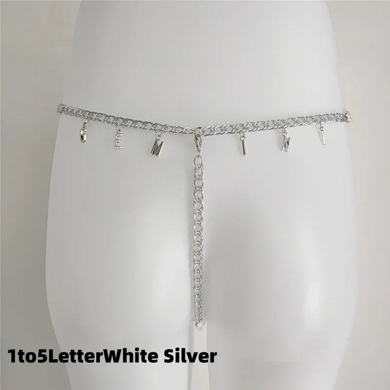 Silver chain waist belt with dangling letter charms and adjustable fit, minimalist style