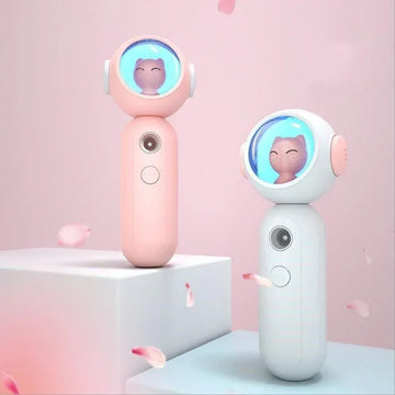 Cute handheld fans in pastel pink and white with cat face design and smooth plastic finish