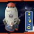 Toy rocket-shaped water sprinkler in gray and red plastic, with included hose adapters.
