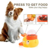 Dog with interactive yellow food dispenser toy, press-to-feed feature, clear top cover