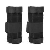Pair of black mesh wrist guards with adjustable straps, breathable material, unisex fit.