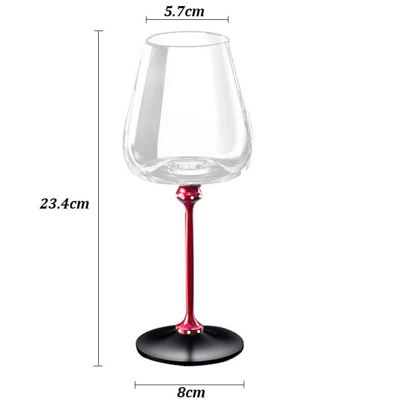 Clear glass goblet with red stem, black base, modern design, and dimensions labeled in centimeters