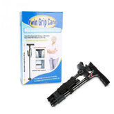 Foldable black walking cane with ergonomic handle and second grip, shown with packaging.